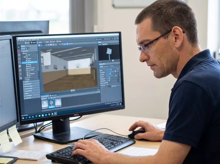 Réalisation d'un plan 3D d'aménagement par l'équipe MGP Matic sur ordinateur